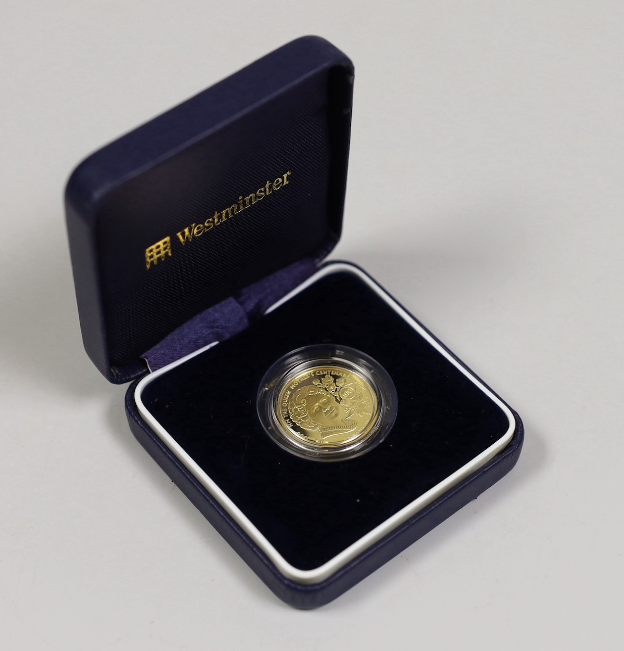 A cased Westminster Mint 2000 Guernsey 1/4 oz gold proof £25